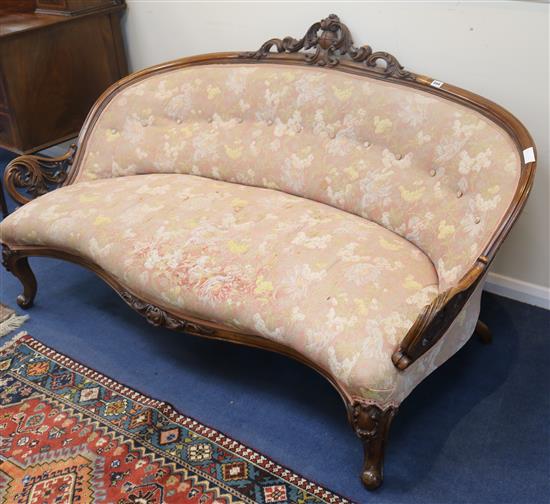 A Victorian carved walnut settee, W.167cm